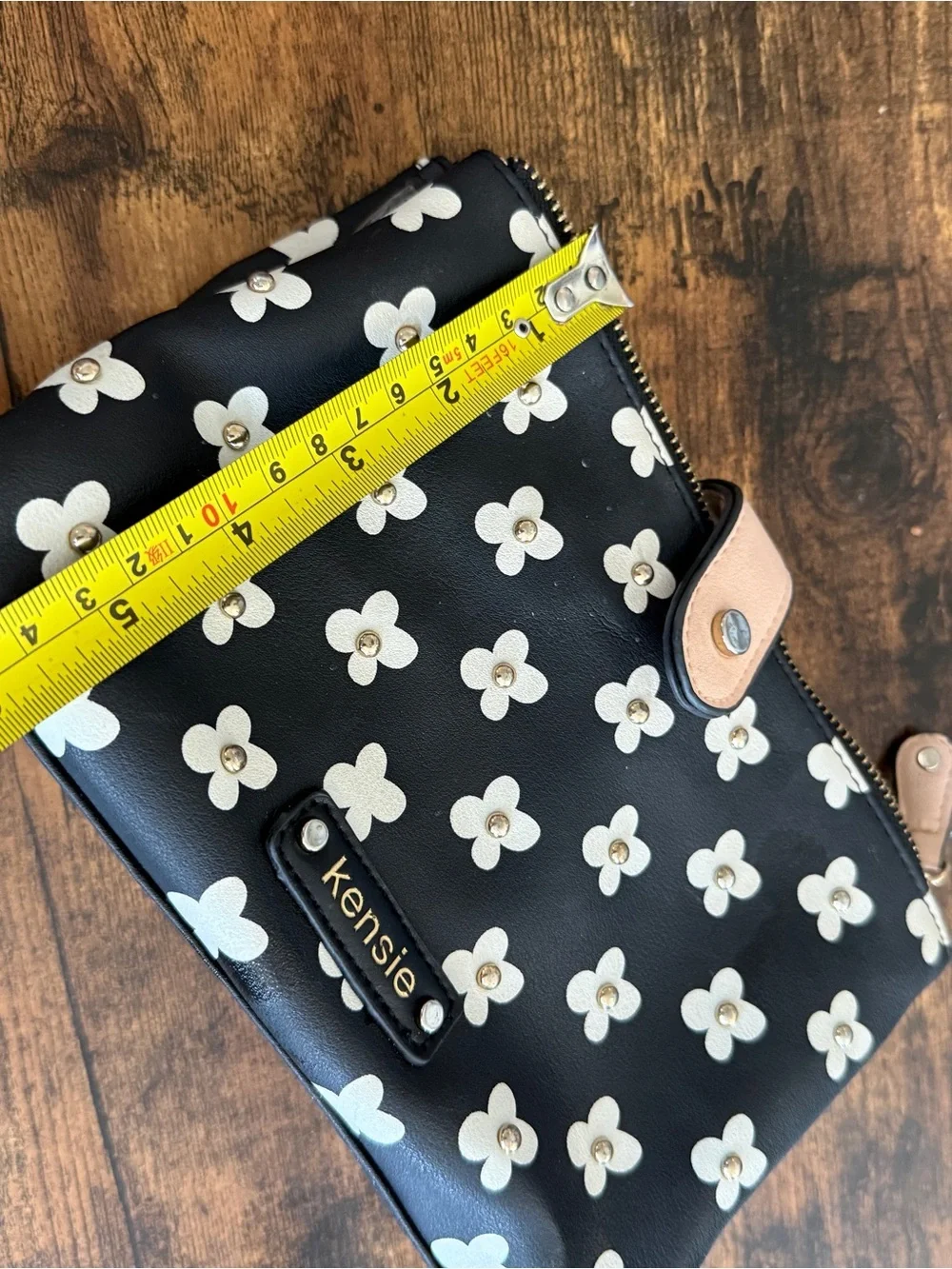 Kensie Black and Cream Floral Zip Wristlet with Tan Snap Strap
